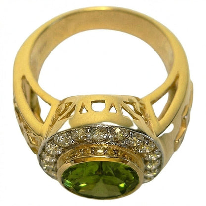 Angled underside view revealing openwork filigree gallery, CZ diamond halo border, and oval peridot in 14K yellow gold plated bishop ring